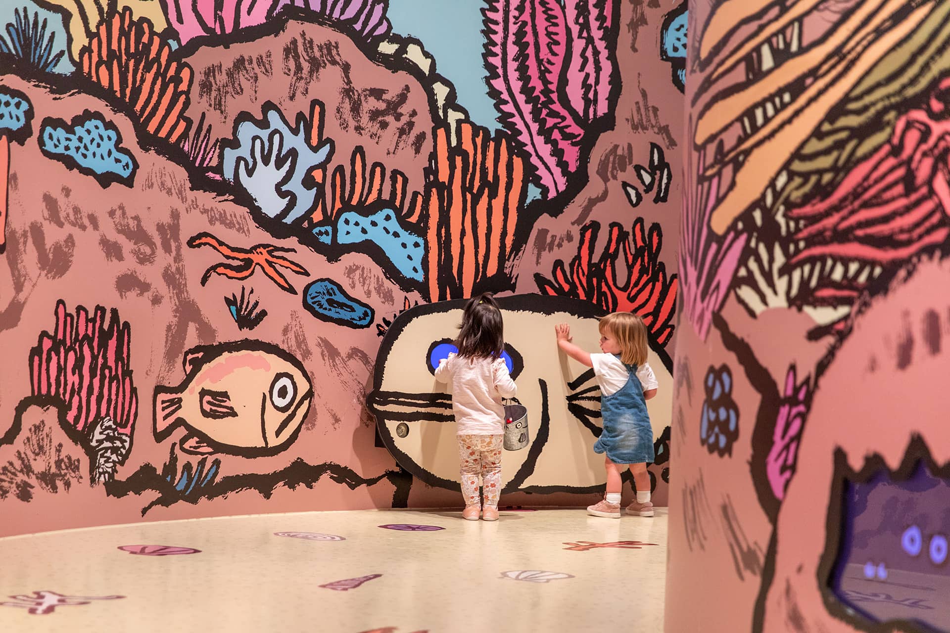 Young visitors enjoying <em>RIFIFI: Jean Jullien for Kids</em> on display as part of NGV Triennial  at NGV International, Melbourne. Photo: Kate Shanasy