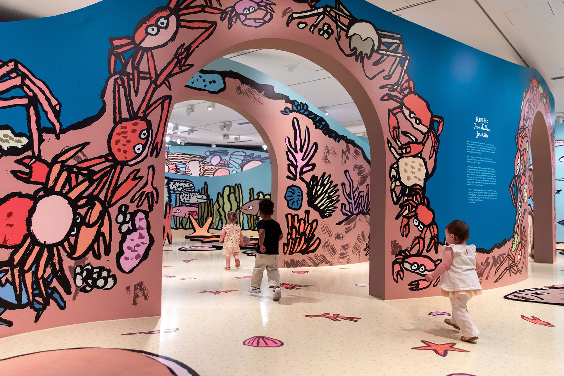 Young visitors enjoying <em>RIFIFI: Jean Jullien for Kids</em> on display as part of NGV Triennial  at NGV International, Melbourne. Photo: Kate Shanasy